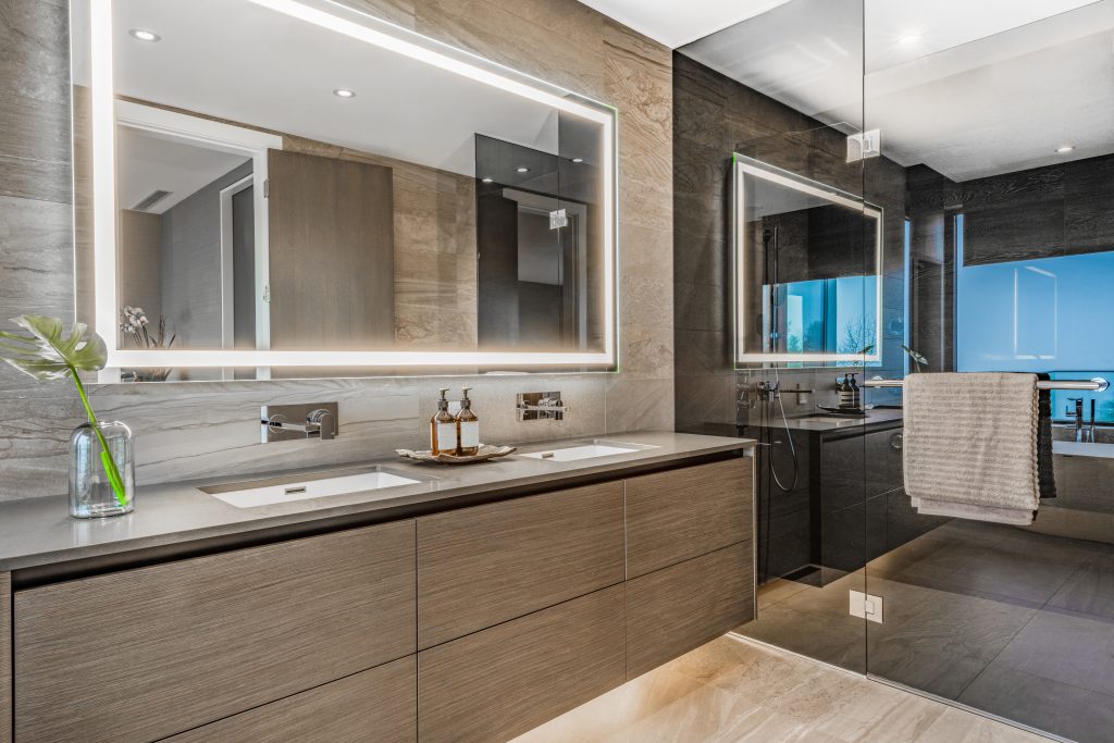 luxury bathroom with backlit mirror